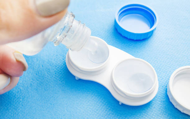 Contact lenses in a plastic container with solution. stock photo
