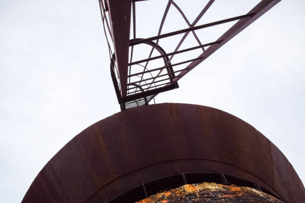 istock Rusty water tower against sky. Old water pump. 1218372558