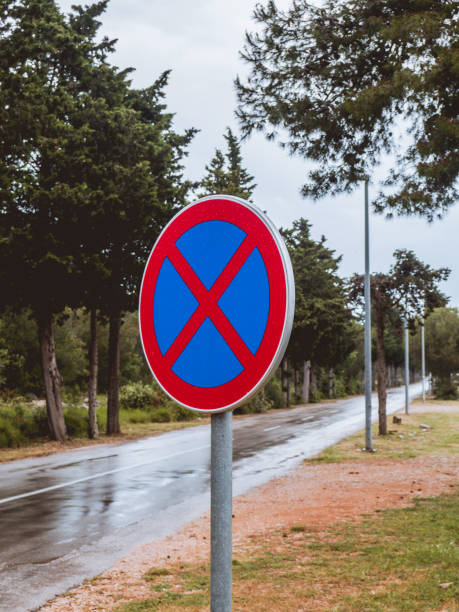 istock No stopping road sign on an empty road 1218375169