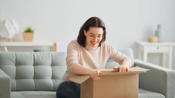 istock woman is holding cardboard box 1218377397
