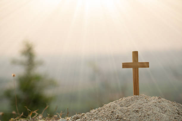 istock Religious concepts. Christian wooden cross on a background with dramatic lighting,  Jesus Christ cross, Easter, resurrection concept. Christianity, Religion copyspace background. 1218377607