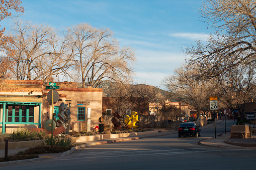 Santa Fe, USA - February 2, 2020. Canyon Road at sunset. Canyon Road is a historic arts district in Santa Fe, home to hundred of galleries and boutiques, with art works from all over US and world. It is a cultural center and major tourist attraction in Santa Fe, New Mexico, USA.