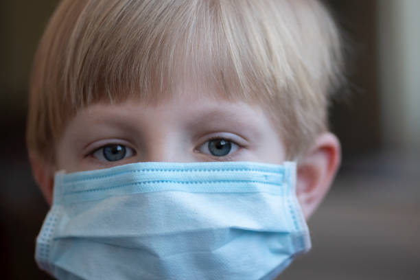 istock Child wearing face mask for protection from Coronavirus 1218380660
