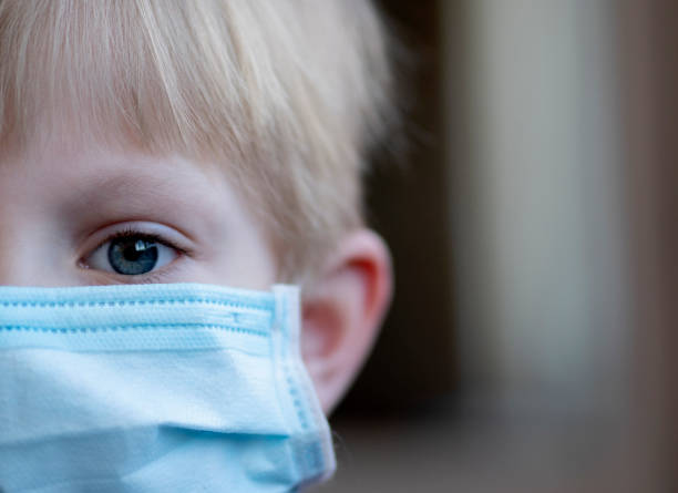 istock Child wearing face mask for protection from Coronavirus 1218380667
