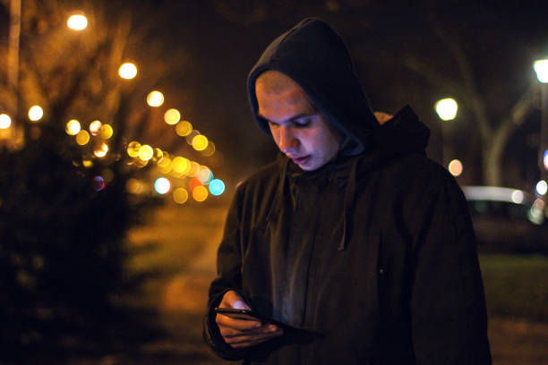 istock Young boy in city at night 1218383089