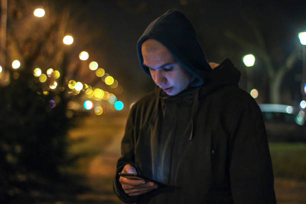 istock Young boy in city at night 1218383095