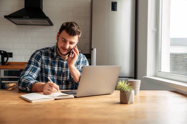 istock Young male freelancer works from home 1218385370