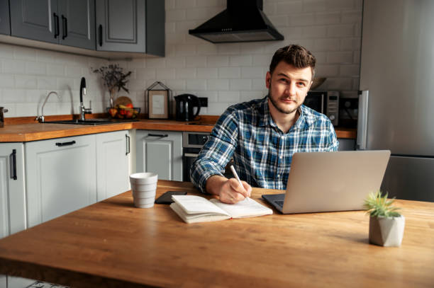 istock Young male freelancer works from home 1218385385