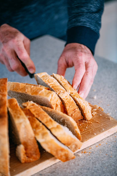 istock Slicing Homemade Bread 1218386273