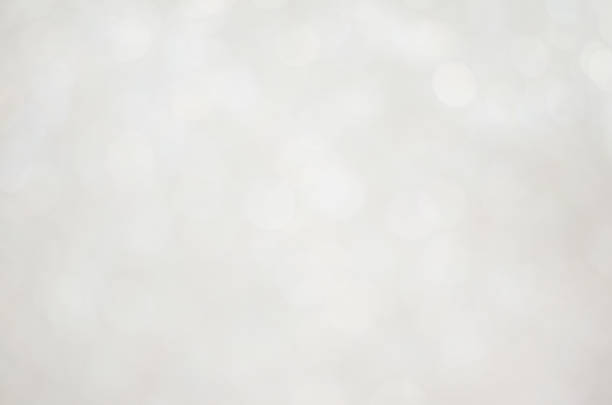 istock abstract white blur bokeh glitter sparkle no color background. 1218396386
