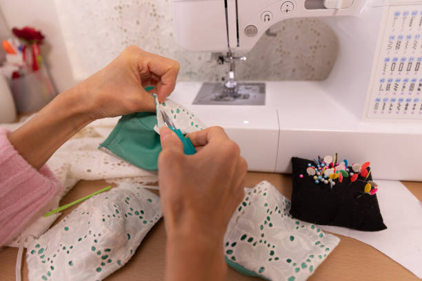 istock Japanese woman making mask at home 1218396618