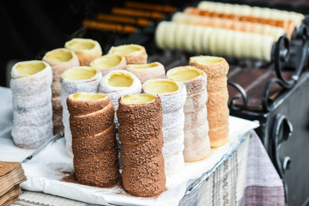 Trdelnik or trdlo is traditional czech sweet hollow roll pastry Trdelnik or trdlo is traditional czech sweet hollow roll pastry dough sell on market place. trdelník stock pictures, royalty-free photos & images