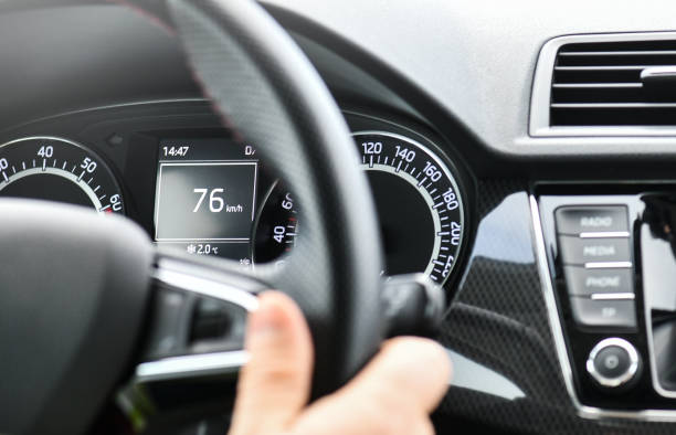 istock The driver is holding the steering wheel with right hand. 1218396995