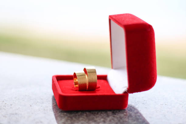 istock Wedding rings on red velvet box. Wedding concept. 1218398565