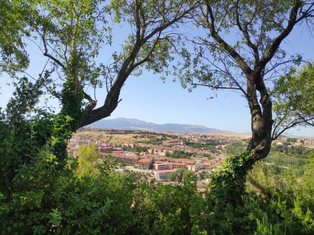 istock a panoramic view of Segovia seen through the trees. 1218399550