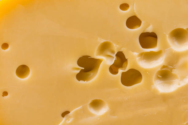 istock yellow cheese with holes 1218399981