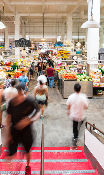 Grand Central Market crowded full LA fresh produce Los Angeles, California, USA. 19th September 2018. Long exposure of people walking at the Grand Central Market in Los Angeles. Produce market with fresh vegetables, fruits and restaurants crowded. walking point of view stock pictures, royalty-free photos & images