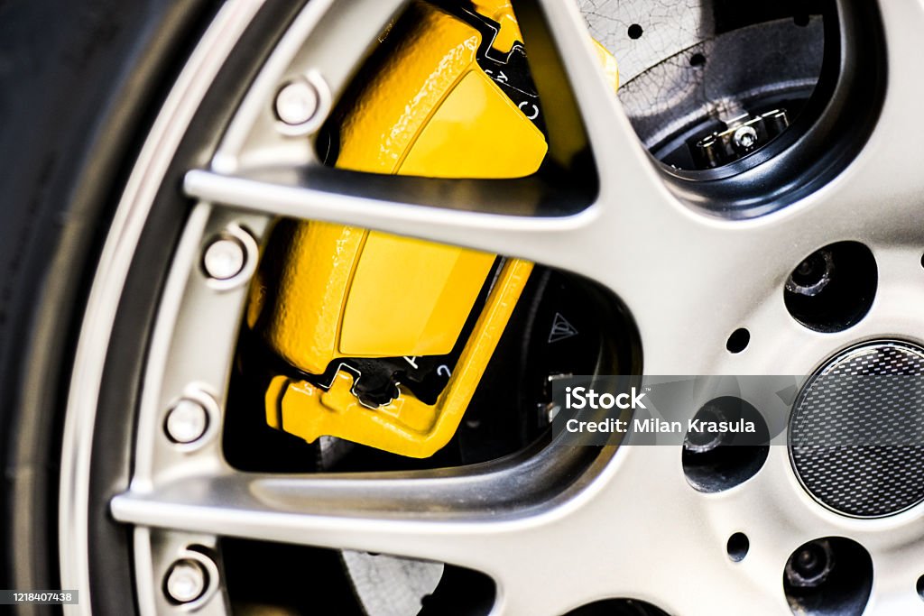 Sport bbs wheel rim close up. Detail of yellow new brake pads changed Sport bbs wheel rim close up. Detail of yellow new brake pads changed on luxury car. Sports Race Stock Photo