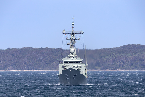 Jervis Bay, Australia - October 1, 2013: HMAS Sydney (FFG 03) Adelaide-class guided-missile frigate of the Royal Australian Navy.