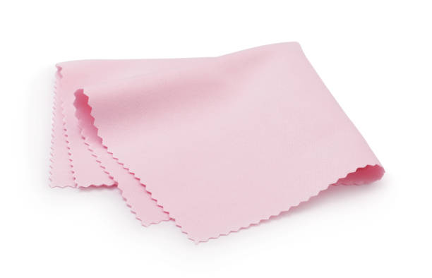 Napkin for optics isolated on a white background. Pink napkin for optics isolated on a white background. microfiber stock pictures, royalty-free photos & images