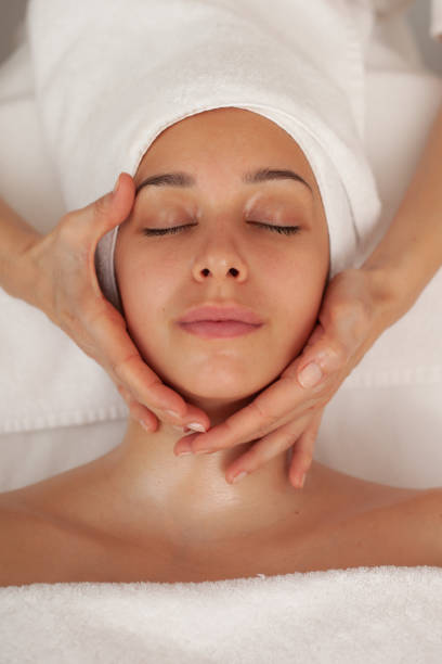 Beautiful Woman Enjoying Head Massage in beauty salon