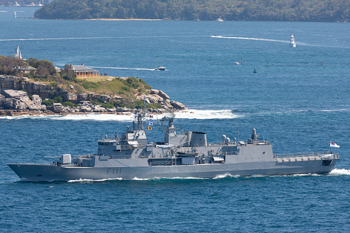 Sydney, Australia - October 11, 2013: HMNZS Te Mana (F111) Anzac class frigates and one of the Royal New Zealand Navy departing Sydney Harbor.