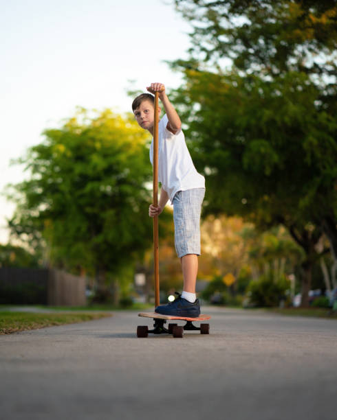 istock Longboard skating around the neighborhood 1218411248