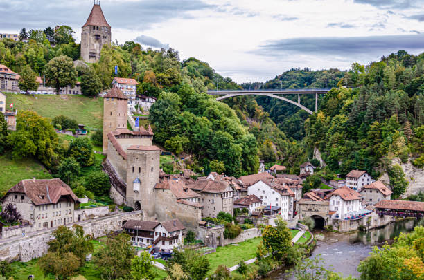 City of Fribourg, Switzerland City of Fribourg, Switzerland - old Bern Gate, Bern Bridge and Gotteron Bridge over the river Saane (Sarine) fribourg city switzerland stock pictures, royalty-free photos & images