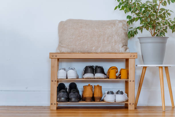istock Shoe rack with family shoes 1218412751