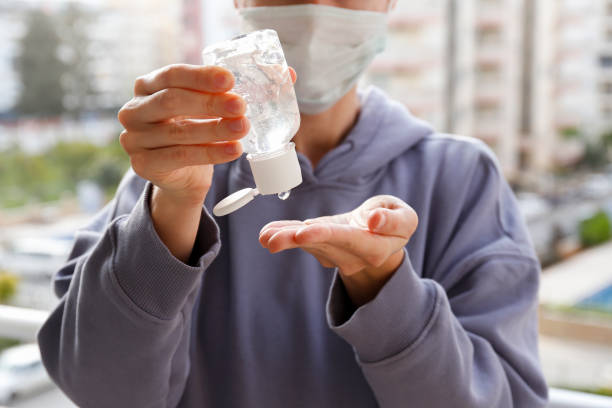 istock Using the disinfectants concept. Female with bottle of sanitizer. 1218416504