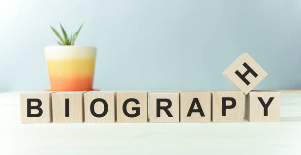 istock BIOGRAPHY word on wooden cube isolated on orange background 1218417566