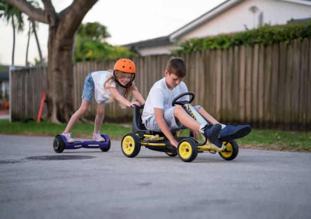 istock Girl power pushing a go kart 1218417780