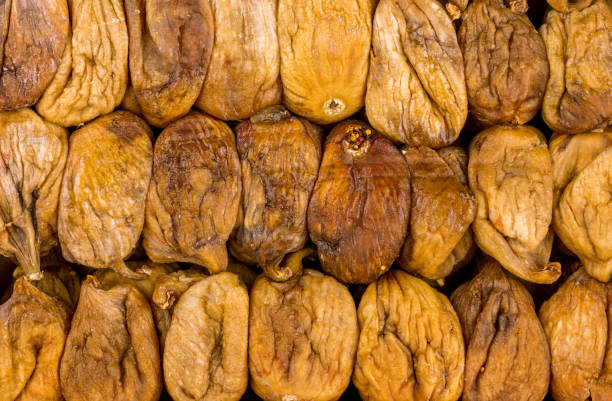 istock dried figs on wooden background 1218417952