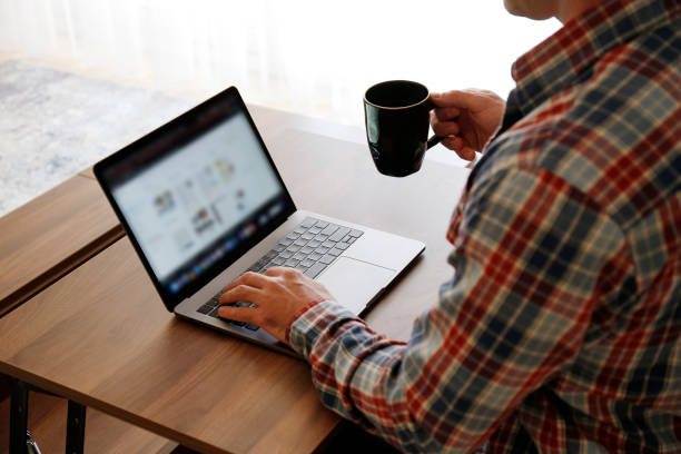istock Conceptual image of man working from home in an improvised office. 1218419595