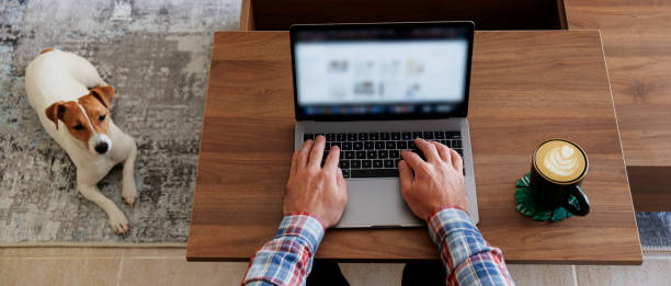 istock Conceptual image of man working from home in an improvised office. 1218419763