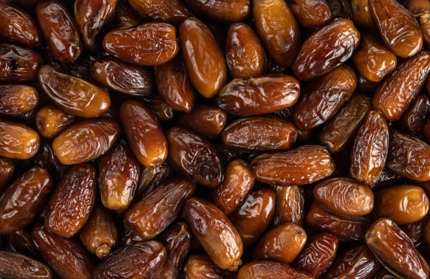 istock The surface texture of selected dried dates. Natural oriental sweets. 1218421156