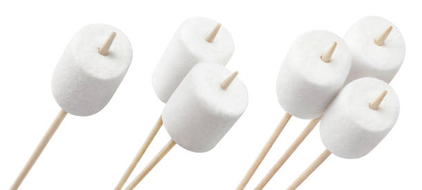 istock Collection of marshmallows on wooden sticks on white 1218423976