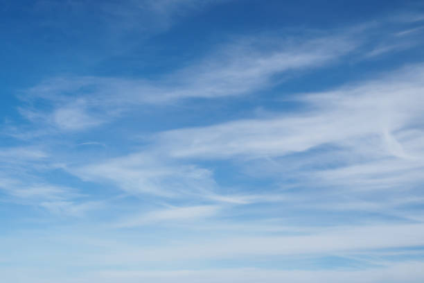 istock Cirrus clouds on blue sunny spring sky, nature background without focus. 1218424963