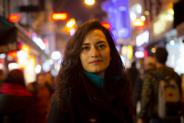 istock Young woman at street 1218425286