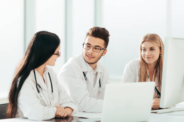 istock group of medical experts discussing online information. 1218426337
