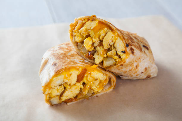 breakfast burrito - prepared potato food studio shot selective focus imagens e fotografias de stock