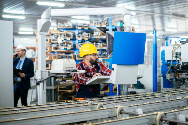 istock Young engineer with quality control inspector in factory stock photo 1218427105