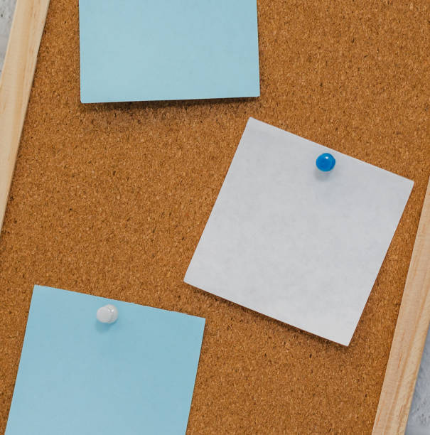istock cork board reminder with stickers and push pins 1218427947