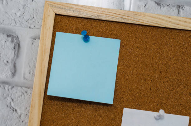 istock cork board reminder with stickers and push pins 1218428018
