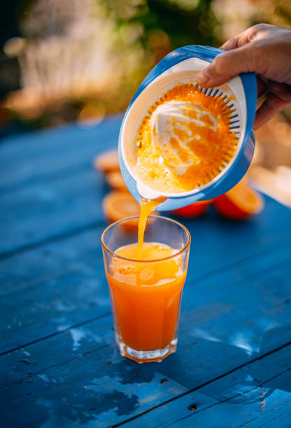 istock Freshly Squeezed Orange Juice in the Garden 1218428183