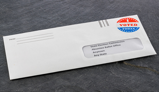 Envelope containing voting ballot papers being sent by mail for absentee vote in presidential election