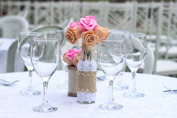 A vibrant bouquet of fresh red roses in full bloom in a clear glass vase, top view