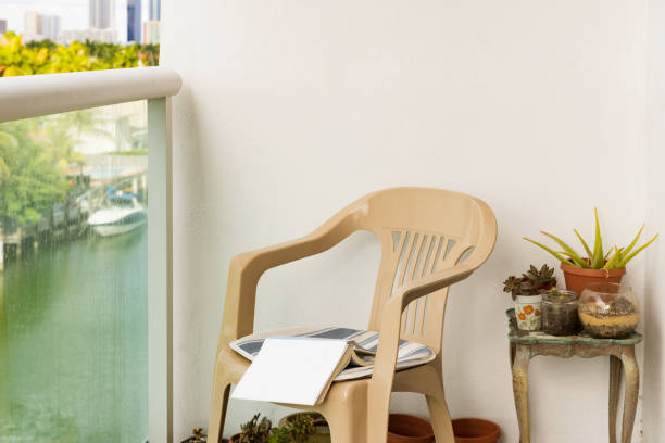 istock Book on an Empty Chair Outdoors on a Balcony During Coronavirus Lockdown in Miami USA 1218432981