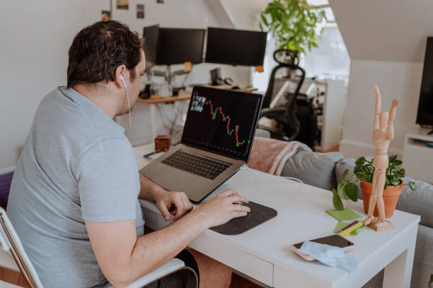 istock Stock market teacher doing a teleconference with students 1218434018