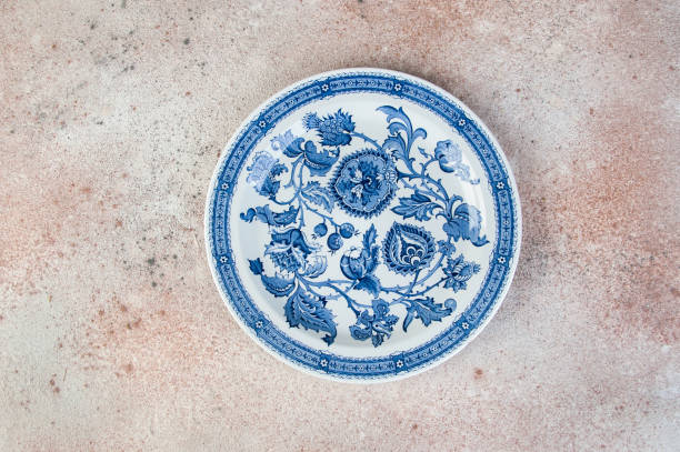 istock Antique porcelain dish on concrete background. 1218434301
